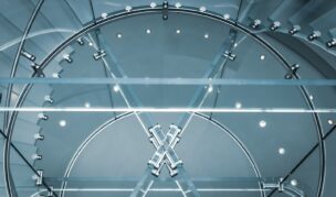 An abstract image of a circular structure with lines and dots